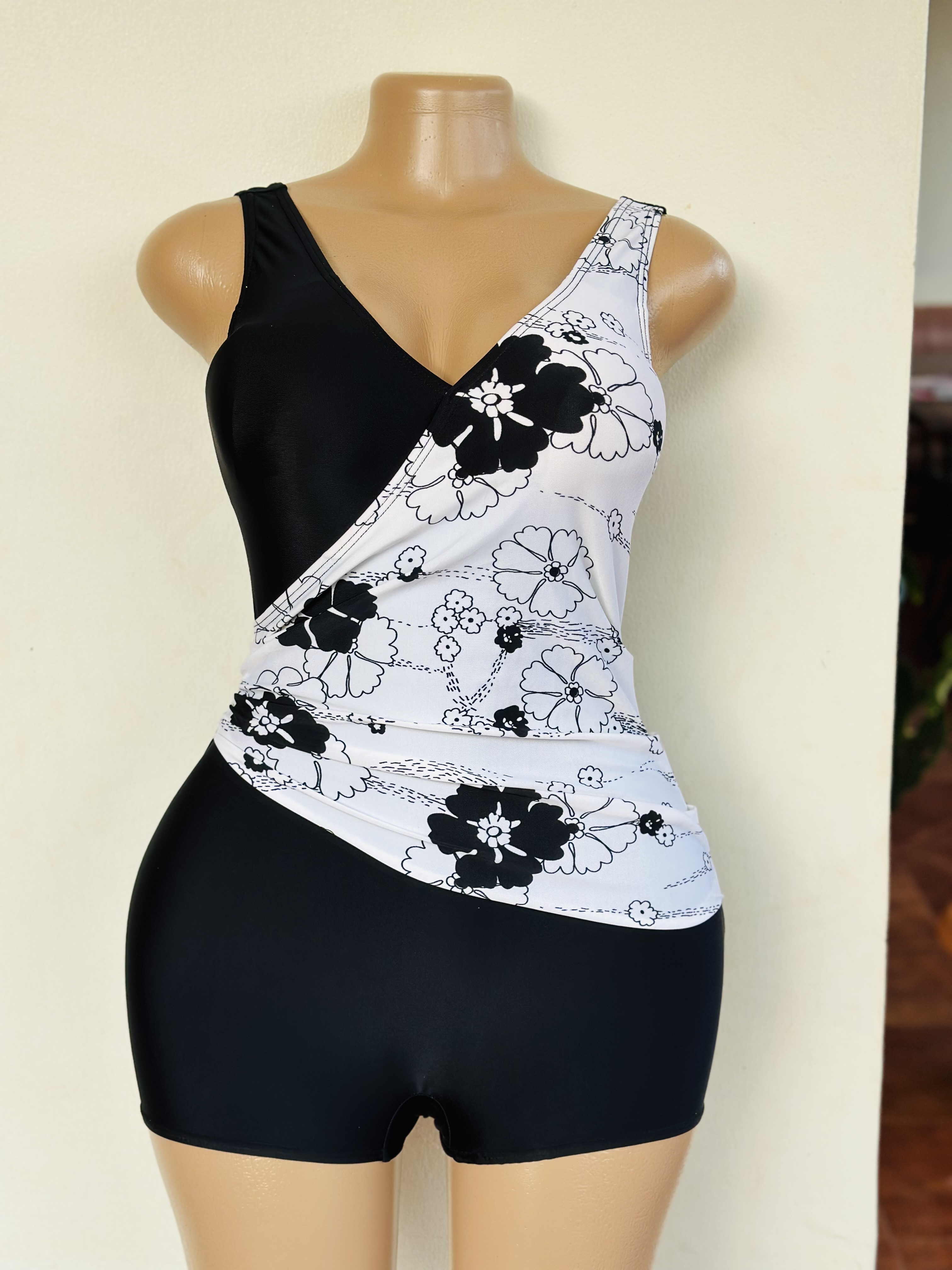 Swimsuit (One Piece in black with a white floral patch)